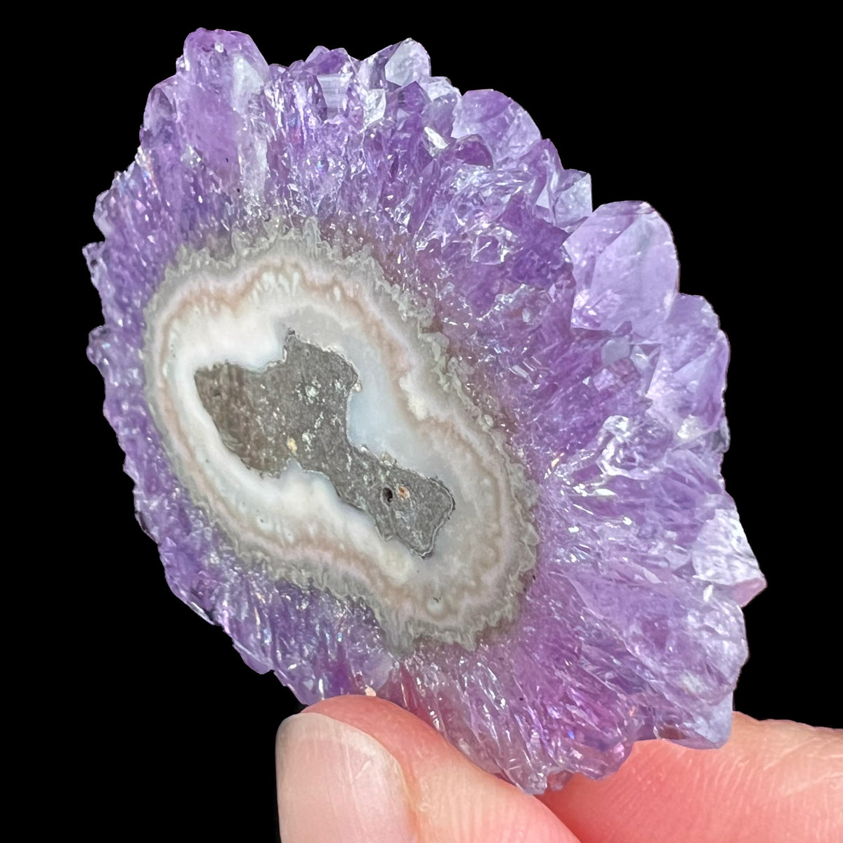 Side view of Purple Amethyst Crystals on Stalactite Slice