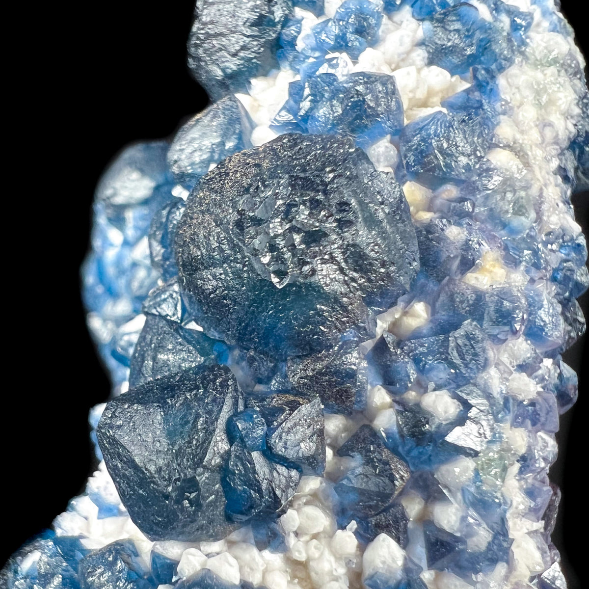 Close Up of Blue Fluorite Crystals on White Quartz